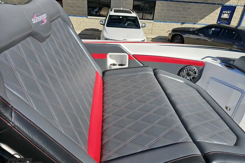 Slide: The Image of 2020 Sunsation 32 CCX boat interior with diamond-stitched seating and speaker detail. - 92