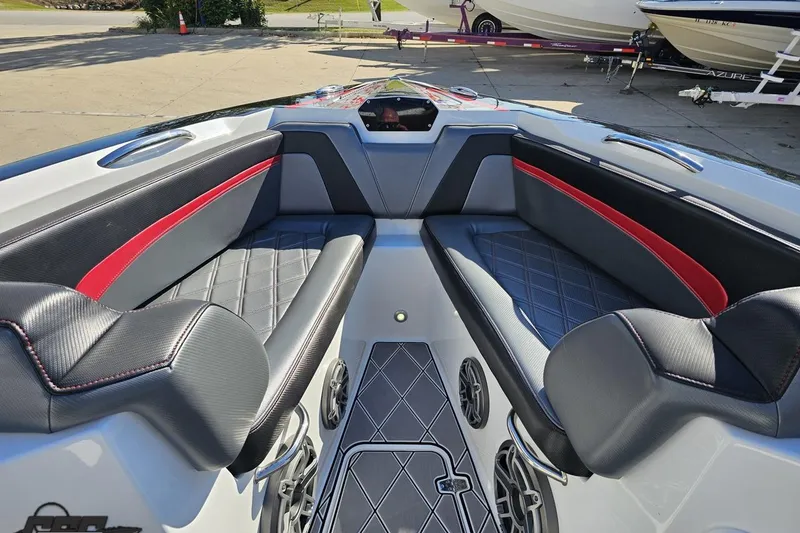 Slide: The Image of 2020 Sunsation 32 CCX boat interior with sleek black and red seating design. - 96
