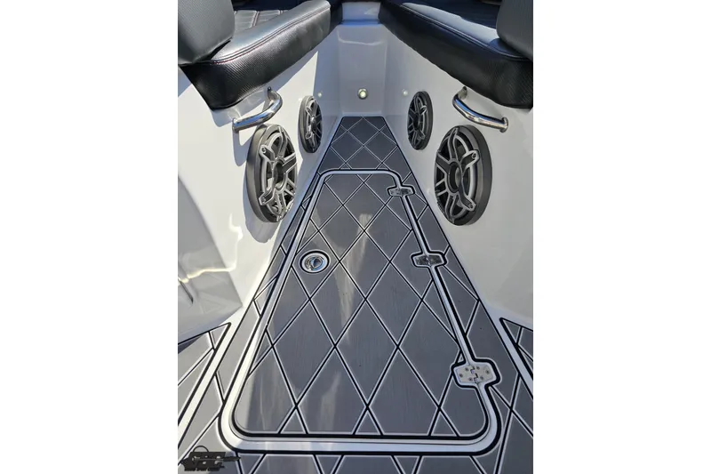 Slide: The Image of 2020 Sunsation 32 CCX boat interior with diamond-patterned flooring and speaker system. - 99
