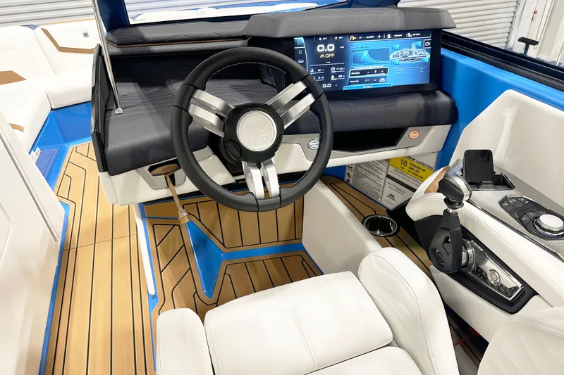 Slide: The Image of 2025 Nautique Super Air Nautique G23 cockpit with modern controls and sleek design. - 7