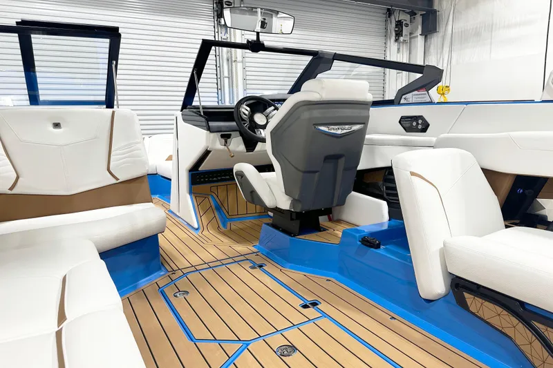 Slide: The Image of 2025 Nautique Super Air Nautique G23 interior with luxurious seating and modern design. - 8