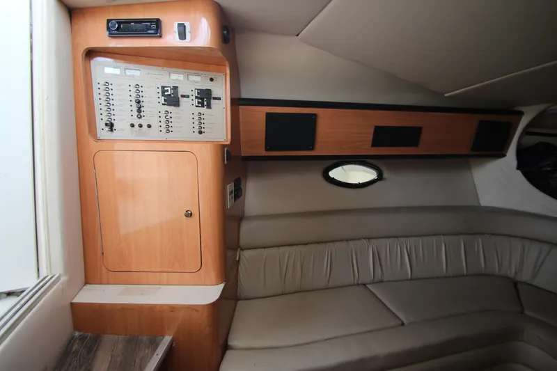 Slide: The Image of 1999 Regal Commodore 322 cabin interior with control panel and seating area. - 17