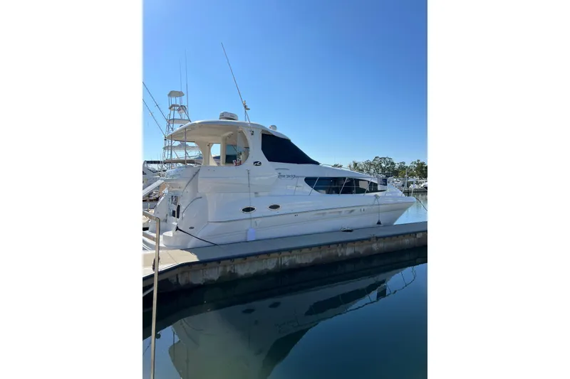 The Image of 2006 Sea Ray 40 Motor Yacht docked at marina under clear blue sky. - 0