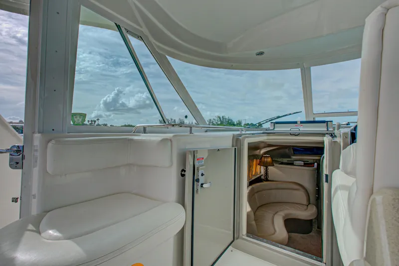 Slide: The Image of 2006 Sea Ray 40 Motor Yacht helm with Garmin navigation and wood steering wheel. - 13