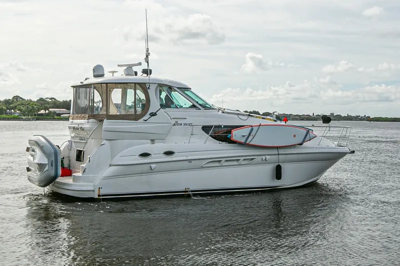 Slide: The Image of Luxurious kitchen interior of 2006 Sea Ray 40 Motor Yacht with wood cabinetry and granite countertops. - 21