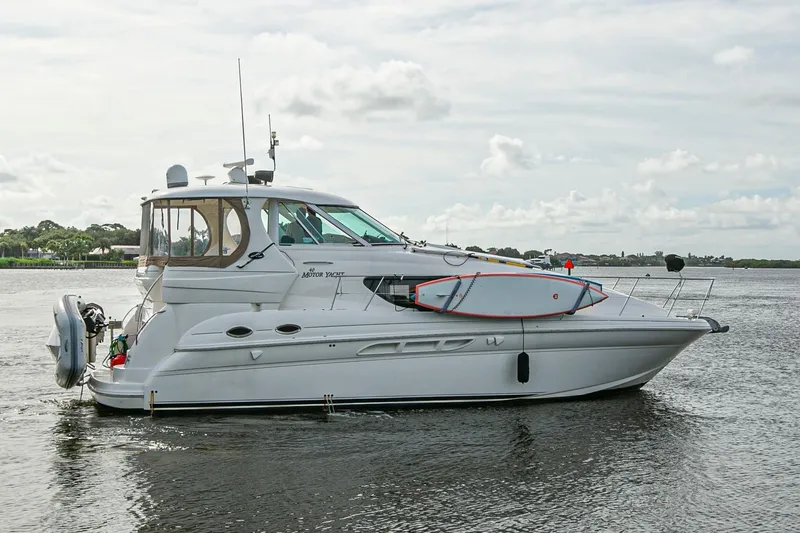 Slide: The Image of Engine room of a 2006 Sea Ray 40 Motor Yacht, showcasing mechanical components and wiring. - 22