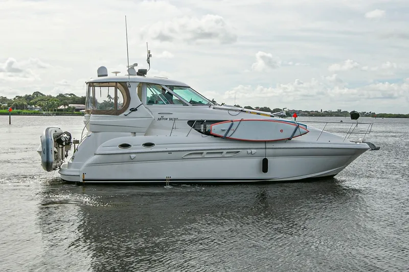 Slide: The Image of Engine room of a 2006 Sea Ray 40 Motor Yacht, showcasing mechanical components and piping. - 23