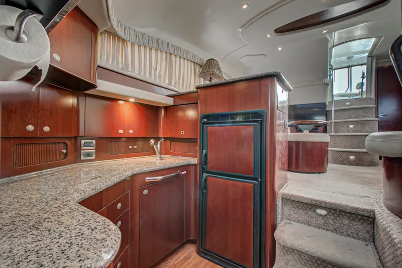 Slide: The Image of Engine room of a 2006 Sea Ray 40 Motor Yacht, showcasing mechanical components and wiring. - 24