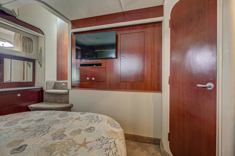 Slide: The Image of Interior of 2006 Sea Ray 40 Motor Yacht, featuring stairs and open door to cabin. - 25