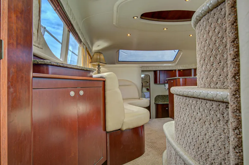Slide: The Image of Interior of 2006 Sea Ray 40 Motor Yacht with wooden cabinetry and carpeted stairs. - 27