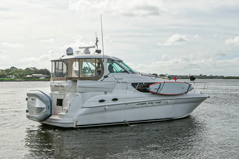 Slide: The Image of 2006 Sea Ray 40 Motor Yacht docked at marina under cloudy sky. - 3