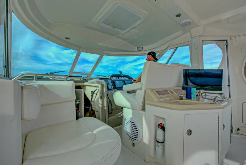 Slide: The Image of 2006 Sea Ray 40 Motor Yacht interior with sink, TV, and window view. - 32
