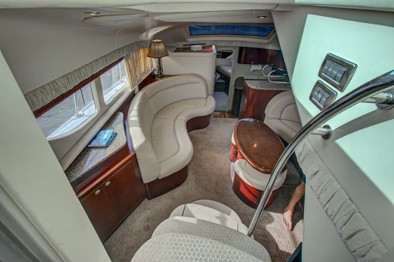 Slide: The Image of Luxurious seating area on a 2006 Sea Ray 40 Motor Yacht, docked at a marina. - 36