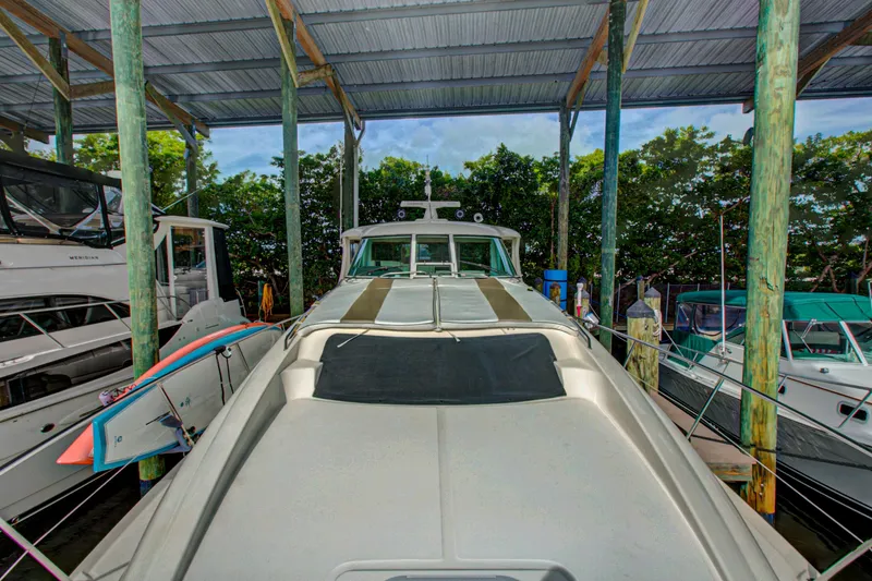 Slide: The Image of Luxurious interior of 2006 Sea Ray 40 Motor Yacht with leather seating and decorative pillows. - 44