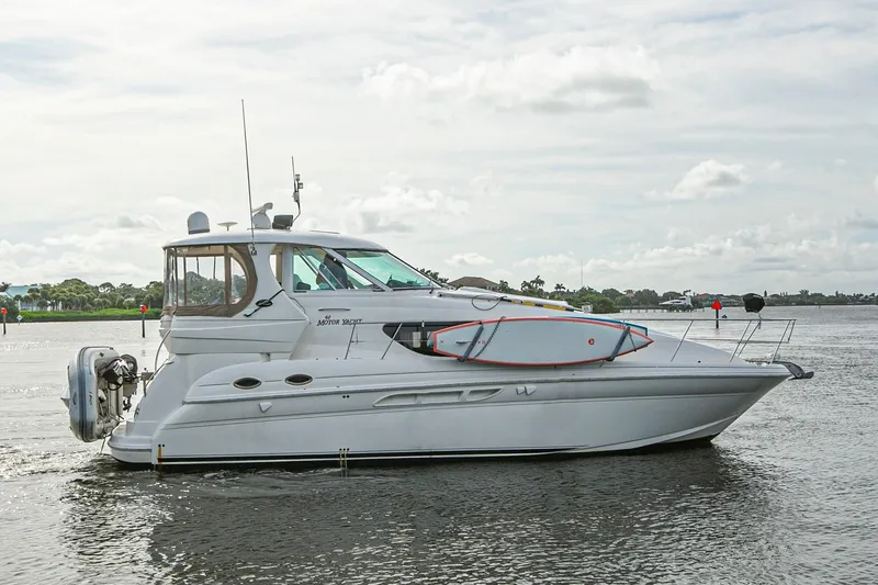 Slide: The Image of 2006 Sea Ray 40 Motor Yacht docked under clear blue sky. - 5