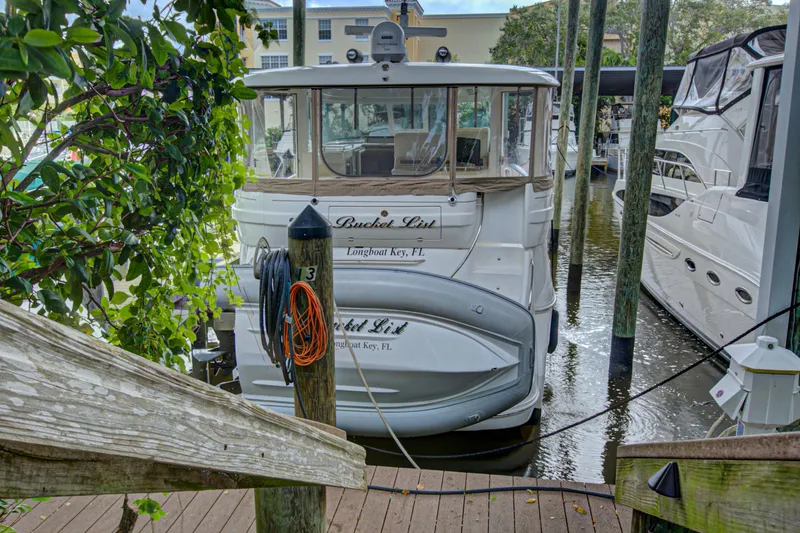 Slide: The Image of Interior of 2006 Sea Ray 40 Motor Yacht with mounted TV and wooden cabinets. - 50