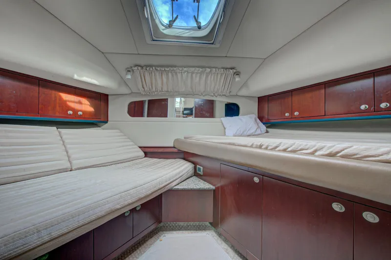 Slide: The Image of Engine room of a 2006 Sea Ray 40 Motor Yacht, showcasing hoses and mechanical components. - 56