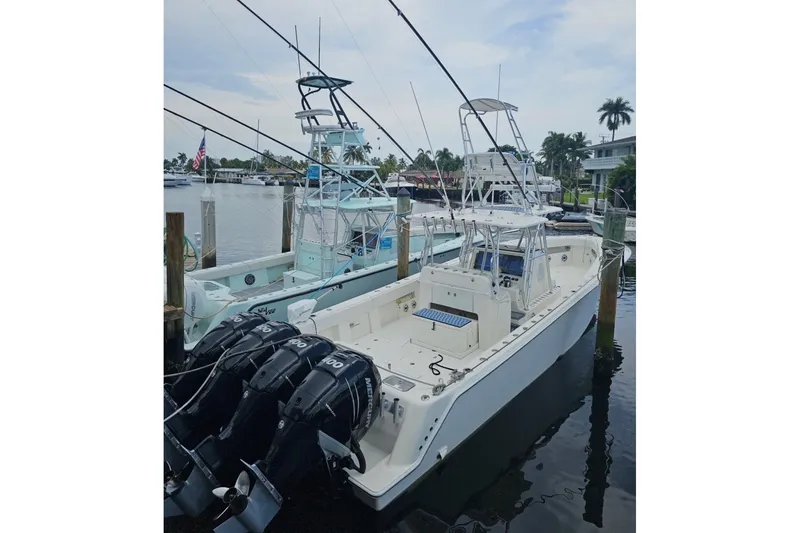 Slide: The Image of 2019 SeaVee 390Z boat docked with multiple outboard engines, ready for fishing. - 10