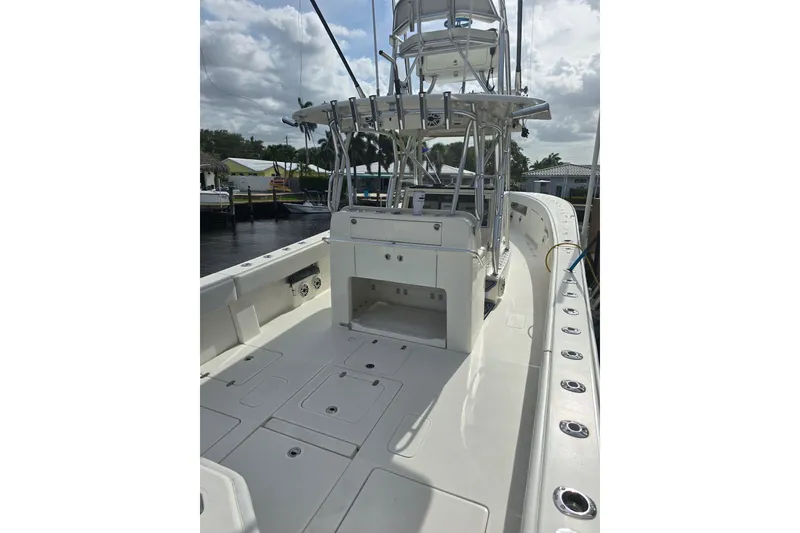Slide: The Image of 2019 SeaVee 390Z boat deck with fishing rod holders and storage compartments. - 3
