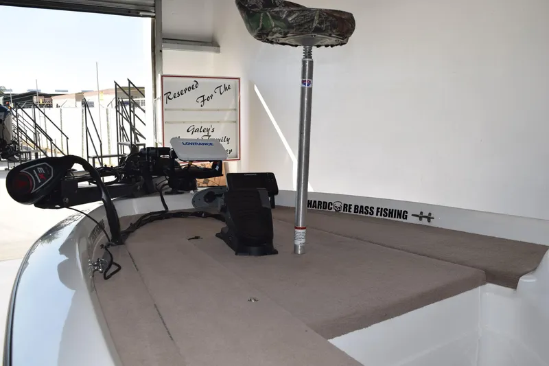 Slide: The Image of 2006 Nitro 640 LX fishing boat interior with trolling motor and Lowrance electronics. - 2
