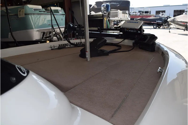 Slide: The Image of 2006 Nitro 640 LX boat deck with fishing equipment in a showroom. - 7