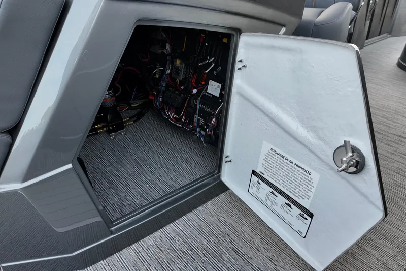 Slide: The Image of Open electrical compartment in 2026 Sylvan M-5 CLZ DC boat, showing wiring and components. - 10