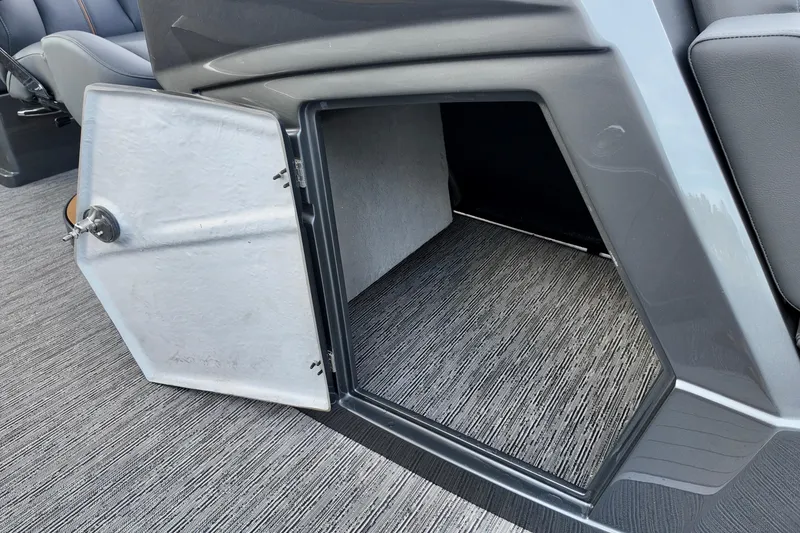 Slide: The Image of Open storage compartment in 2026 Sylvan M-5 CLZ DC boat interior. - 11