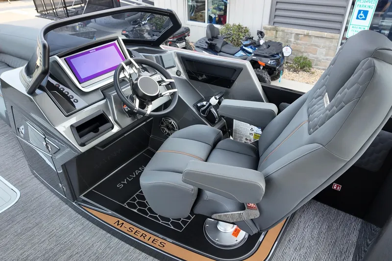 Slide: The Image of 2026 Sylvan M-5 CLZ DC boat interior with modern dashboard and comfortable seating. - 15