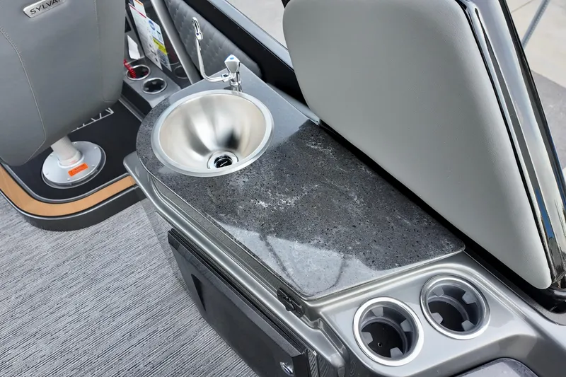 Slide: The Image of 2026 Sylvan M-5 CLZ DC boat interior with sink and cup holders. - 16