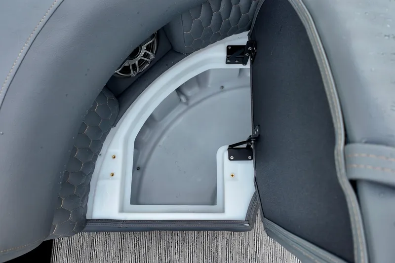 Slide: The Image of Interior storage compartment of 2026 Sylvan M-5 CLZ DC boat with speaker detail. - 7