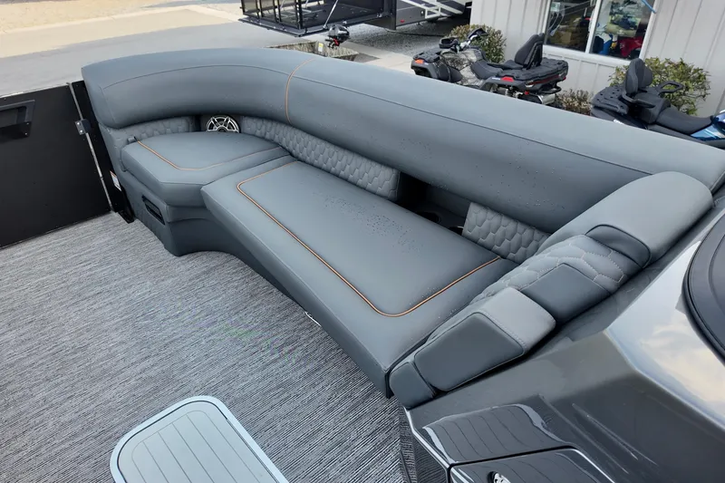 Slide: The Image of Luxurious seating on 2026 Sylvan M-5 CLZ DC boat, featuring sleek gray upholstery. - 8