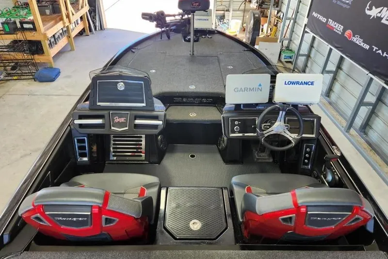 Slide: The Image of 2022 Ranger Z520R boat interior with Garmin and Lowrance electronics, dual seats, and steering wheel. - 4