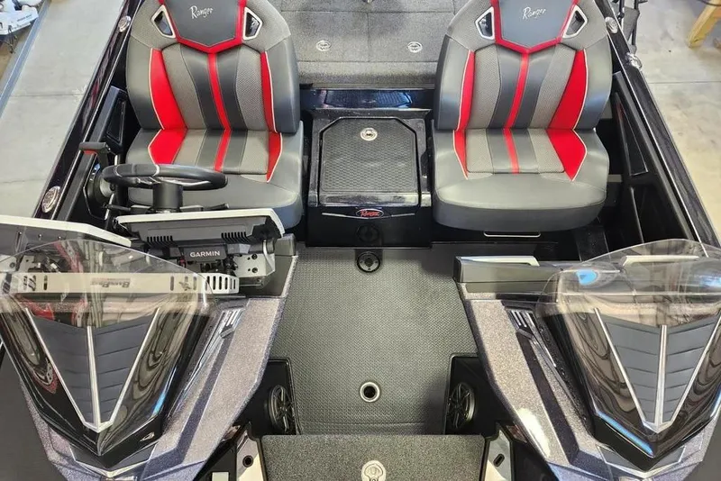 Slide: The Image of 2022 Ranger Z520R boat interior with dual seats and Garmin equipment. - 8