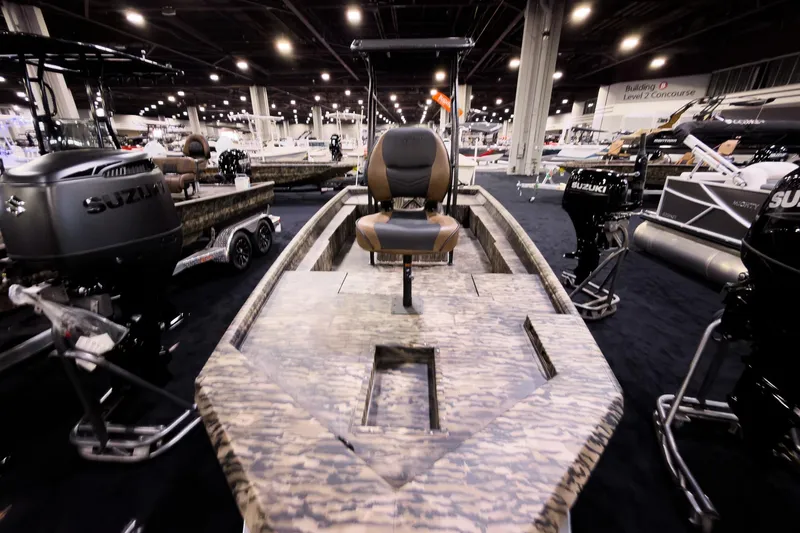 Slide: The Image of 2026 Excel 216 Stalker Center Console boat displayed at an indoor exhibition. - 11