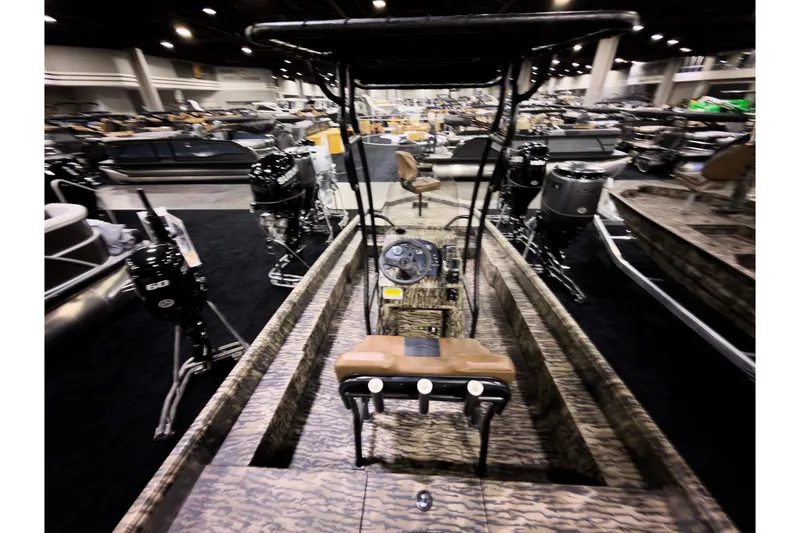 Slide: The Image of 2026 Excel 216 Stalker Center Console boat displayed at an indoor exhibition. - 5