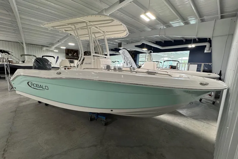 The Image of 2026 Robalo R200 Center Console boat displayed in a showroom. - 1
