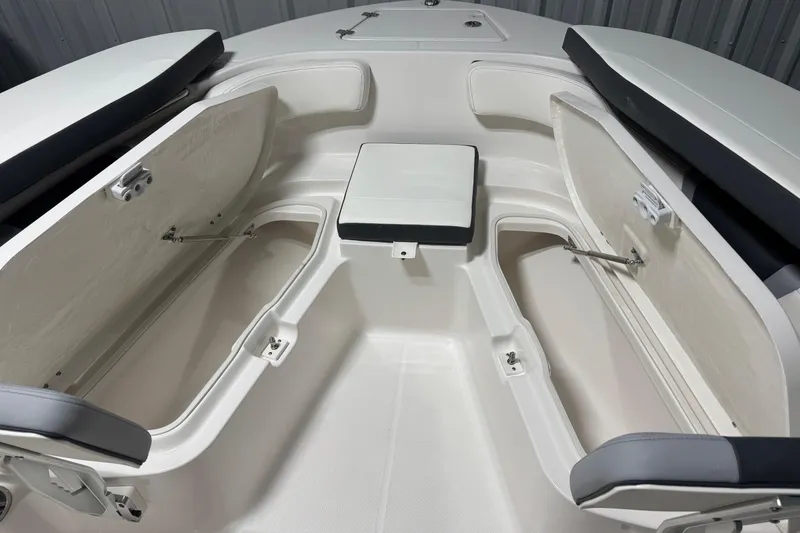 Slide: The Image of 2026 Robalo R200 Center Console boat interior with open storage compartments. - 11