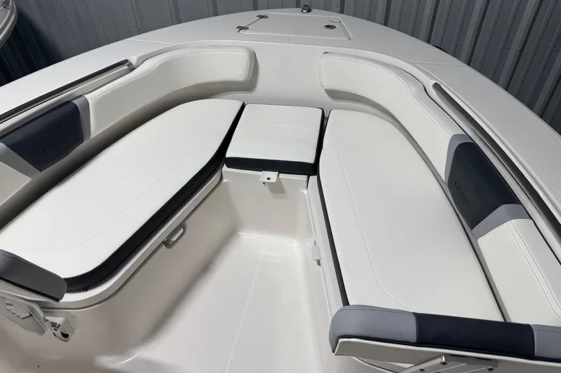 Slide: The Image of 2026 Robalo R200 Center Console boat interior with cushioned seating and storage. - 12