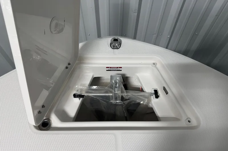Slide: The Image of 2026 Robalo R200 Center Console anchor storage compartment with open hatch. - 13