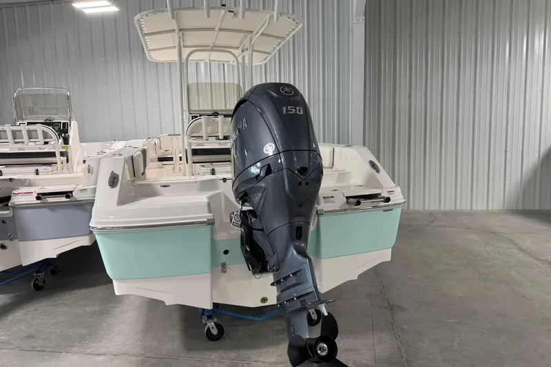 Slide: The Image of 2026 Robalo R200 Center Console boat with Yamaha 150 outboard motor in showroom. - 3
