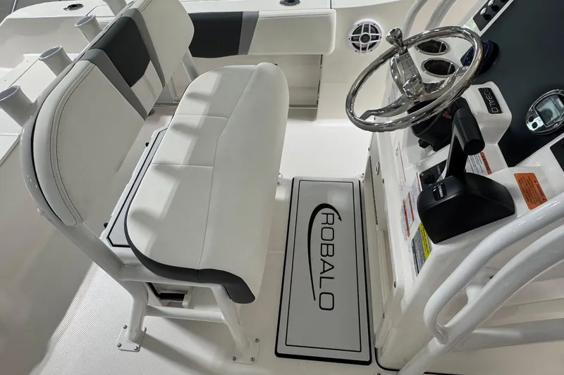 Slide: The Image of 2026 Robalo R200 Center Console boat interior with steering wheel and seating. - 7