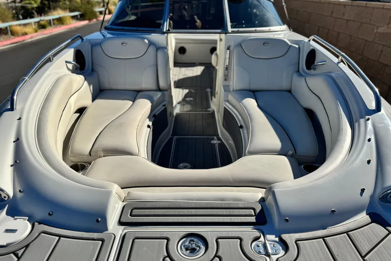 Slide: The Image of 2006 Crownline 260 EX boat interior with spacious seating and sleek design. - 11
