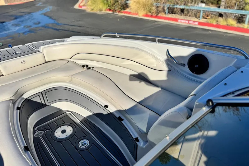 Slide: The Image of 2006 Crownline 260 EX boat interior with white seating and sleek design. - 14