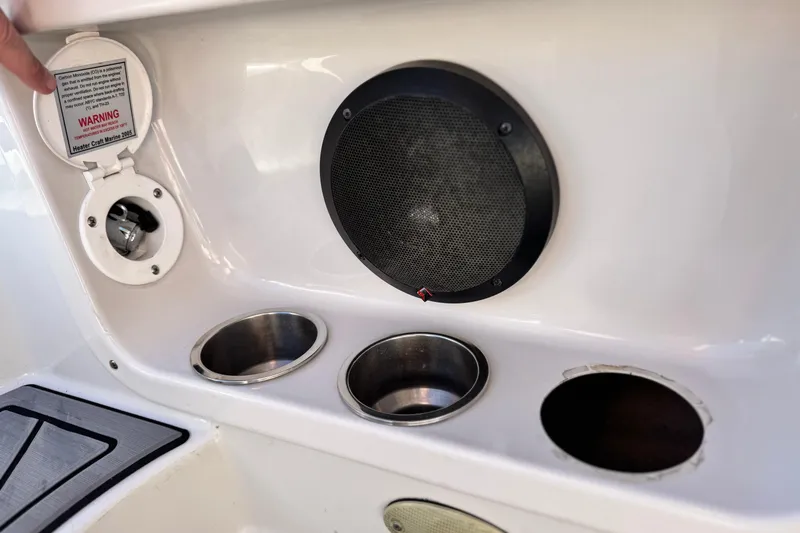 Slide: The Image of 2006 Crownline 260 EX boat interior with speaker and cup holders. - 20