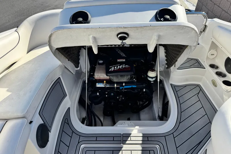 Slide: The Image of 2006 Crownline 260 EX boat engine compartment with Mercury 496 engine, open hatch view. - 23