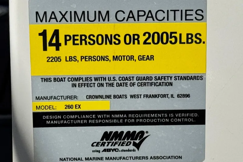 Slide: The Image of Capacity label for 2006 Crownline 260 EX, 14 persons or 2005 lbs, NMMA certified. - 34