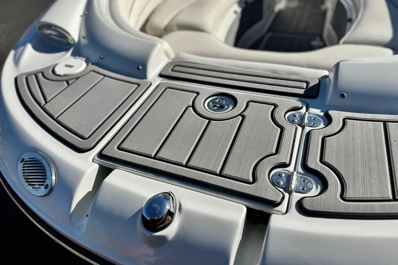 Slide: The Image of Close-up of 2006 Crownline 260 EX boat deck with sleek design and metallic accents. - 9