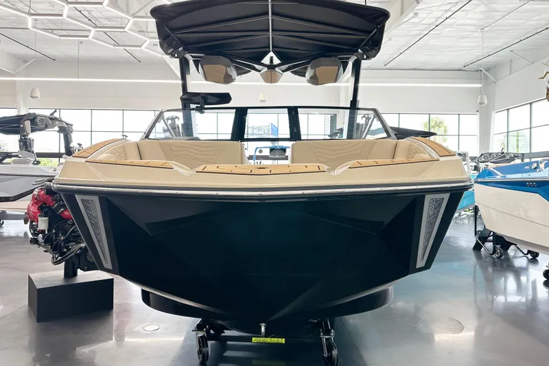 Slide: The Image of 2025 Nautique Super Air Nautique G23 Paragon boat displayed in a showroom. - 3