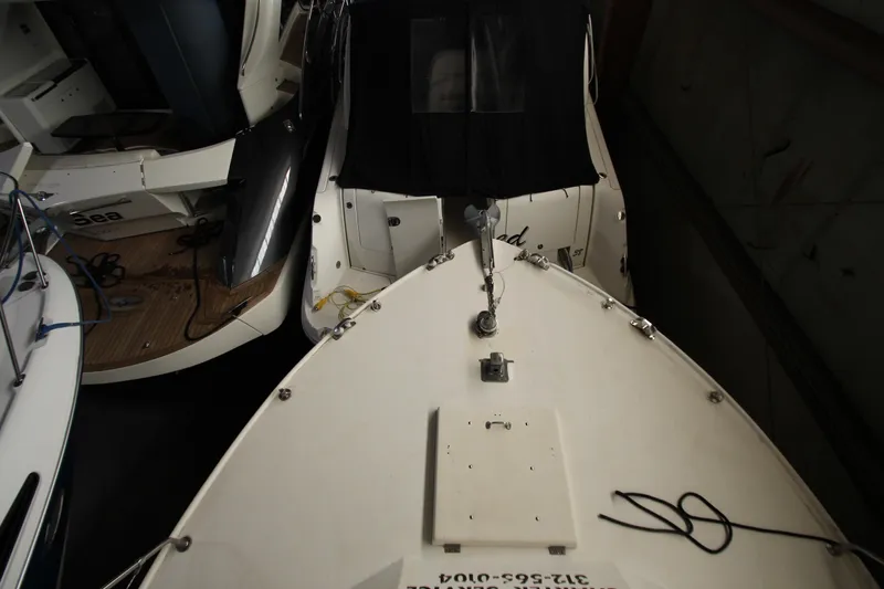 Slide: The Image of 1980 Delta Boatworks 34 Offshore in storage, view from above, showing deck and adjacent boats. - 14