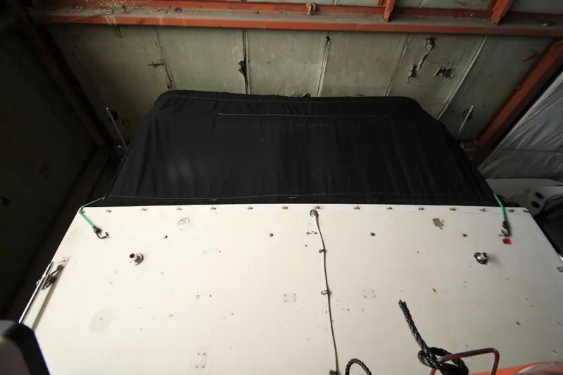 Slide: The Image of 1980 Delta Boatworks 34 Offshore, covered and stored indoors, view from above. - 15